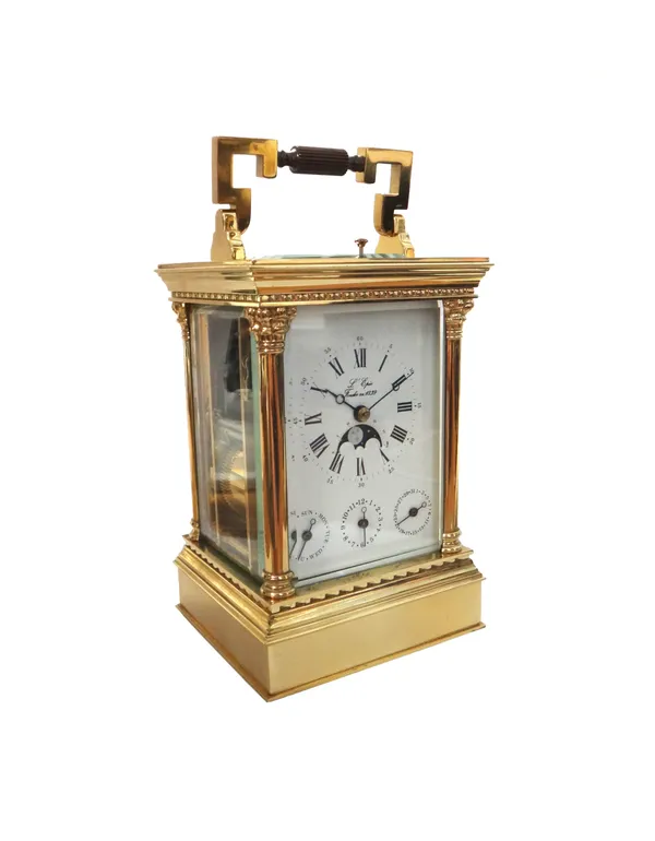 A L'Epee brass repeating carriage clock, with visible escapement and push button repeat over a white enamel dial, scroll painted moon phase and three
