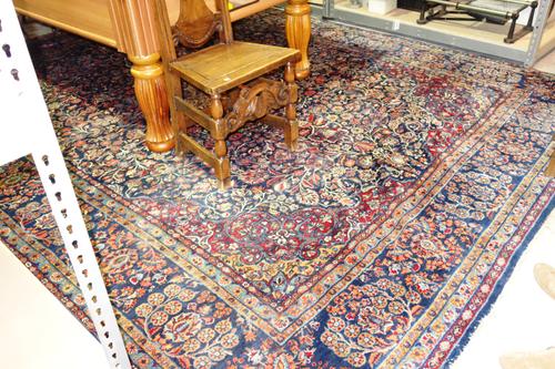A Meshed carpet, circa 1920s, dark blue field, 386cm x 284cm.   E2