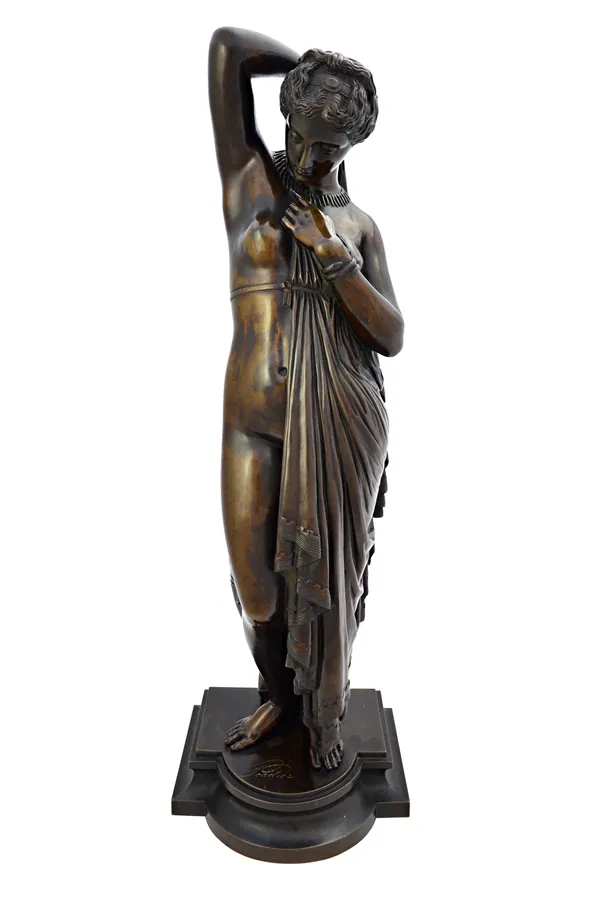 After James Pradier (1790-1852), a bronze figure, late 19th century, depicting 'Phryne' semi-clad in a classical robe, on a breakfront stepped base, s