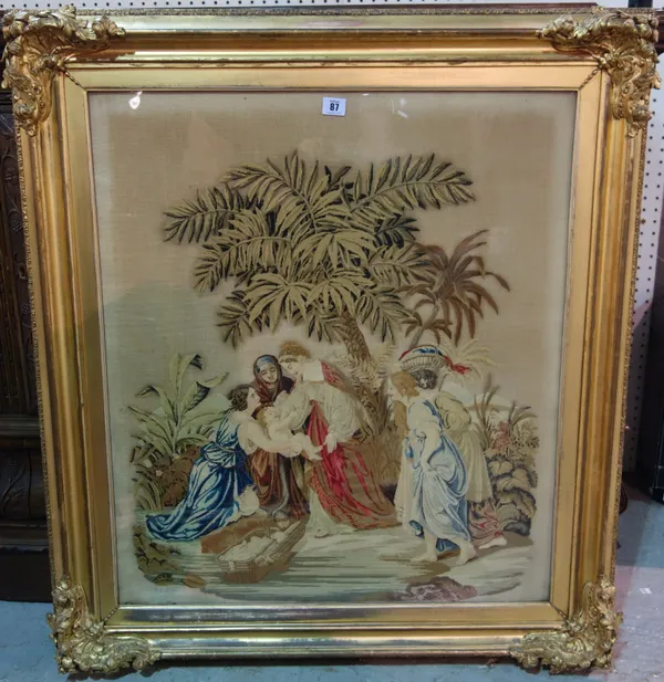 A Victorian woolwork picture, depicting a biblical scene, housed in a gilt gesso frame, 77cm x 65cm.ROST