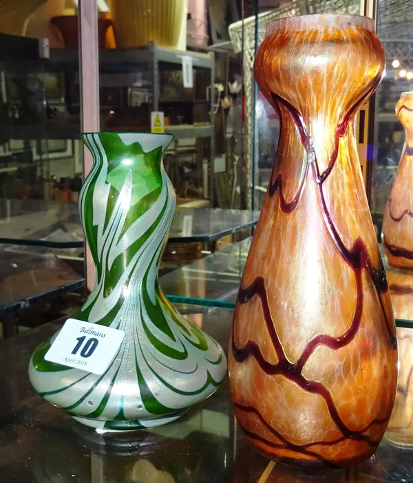 A 20th century Loetz style green glass vase and another similar orange glass vase, (2). Tallest 17cm. CAB