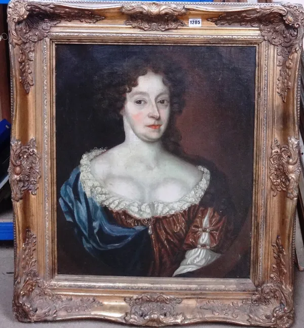 Follower of Sir Peter Lely, Portrait of a lady, oil on canvas, in a feigned oval, 63cm x 52cm.