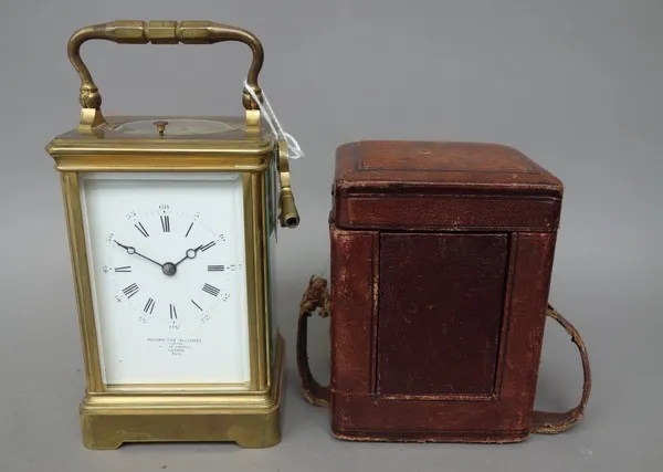 An early 20th century gilt brass cased carriage clock, the white enamel dial detailed 'GOLDSMITH ALLIANCE LTD', with push repeat, two train movement a