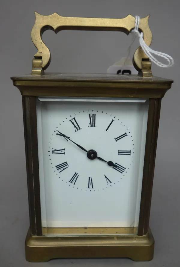 An early 20th century brass cased carriage clock, with white enamel dial and single train movement, 11cm high.