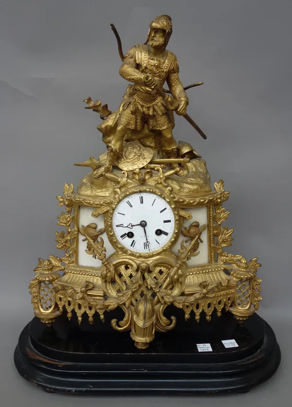 A French ormolu gilt metal figural mantel clock, late 19th century, surmounted with a mythological warrior figure over a marble inset gilt spelter cas