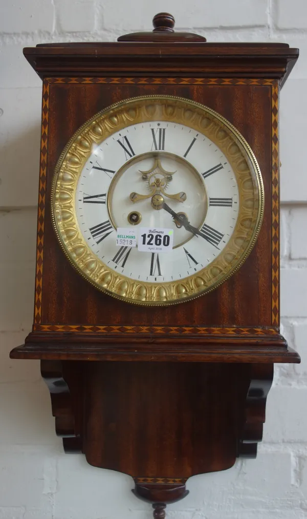 A mahogany and cross banded wall/bracket clock, with brocote escapement and two train movement, 57cm high, (key & pendulum)