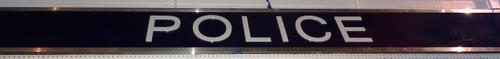 A 20th century metal framed rectangular 'Police' sign, 525cm wide x 48cm high.  CAB