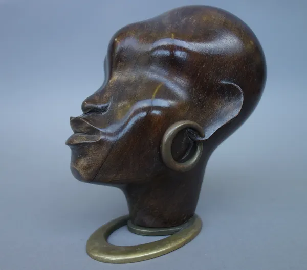 A Hagenauer hardwood and bronze African woman's head, circa 1930, with bronze earrings, stamped marks to base, 13cm high.