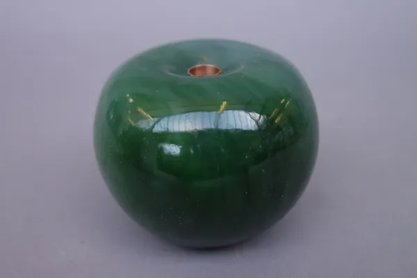 A hardstone pen holder in the shape of an apple, 5cm high.