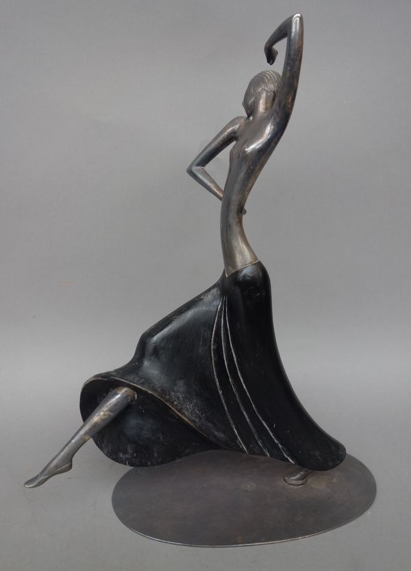 A Hagenauer silver plated and ebonised model of a dancer, circa 1930, modelled with leg outstretched, on an oval plated base, stamped 'Hagenauer Wein
