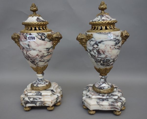 A pair of Continental marble garniture vases and pierced covers, 20th century, with gilt metal Bacchus mask handles against an urn shaped body, with s