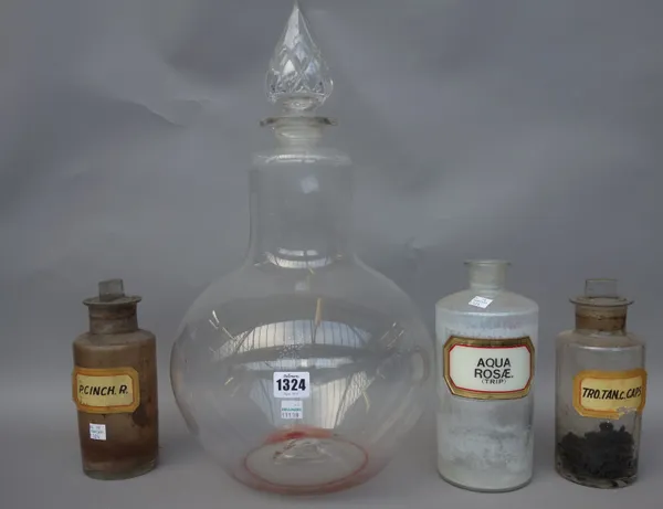 A large glass chemist's jar with a cut glass 'spire' shaped stopper, 48.5cm high, a smaller cylindrical jar, and eighteen further apothecary jars and