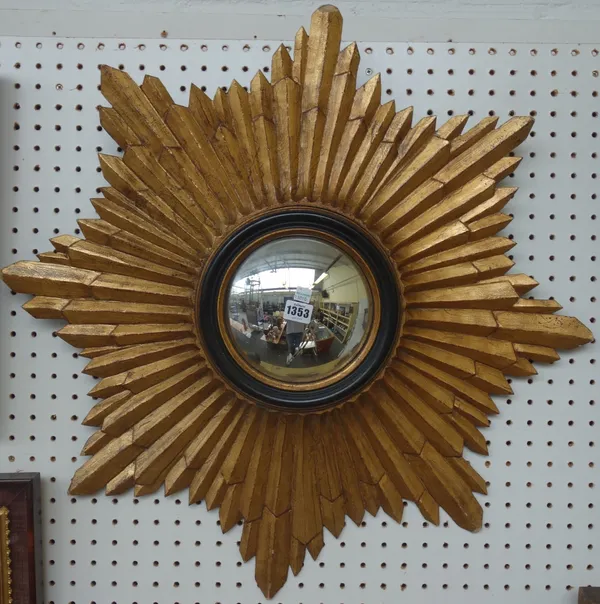 A modern giltwood carved 'Sunburst' wall mirror, with convex plate to centre, 72cm wide.