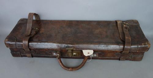 An early 20th century leather, wood and canvas lined shotgun cartridge case by Chas Lancaster, London, with interior paper label to the lid (a.f), 79c