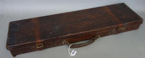 A leather shotgun case by Wilhaim Leech, Chelmsford, 19th century, with interior paper label, 80cm wide, a smaller canvas bound case by Joseph Harkom