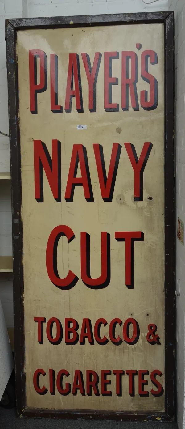 A 1930s enamel cigarette advertising sign, 'Players Navy Cut Tobacco & Cigarettes', framed, 200cm x 75cm.