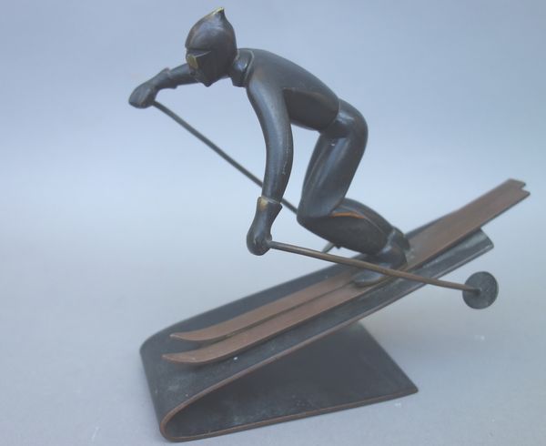 A Hagenauer style patinated bronze downhill skier, by Richard Rohac, of Art Deco form, with stamped mark to the base, 15cm high.  Illustrated