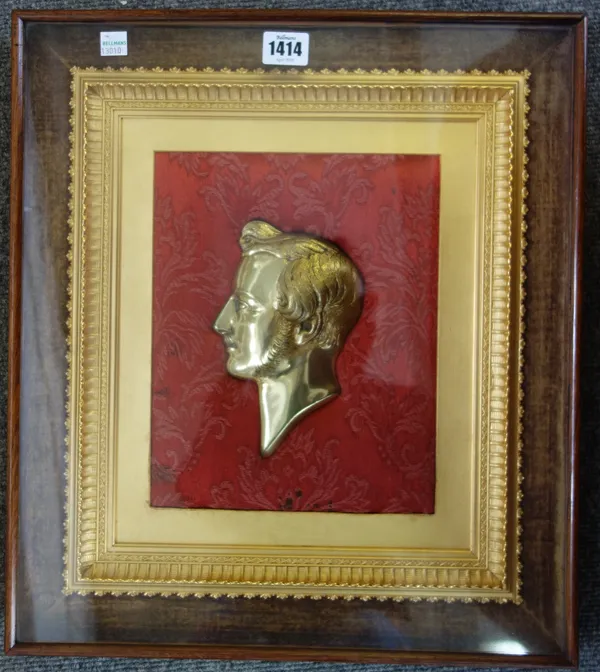 A pair of gilt metal relief cast portrait plaques, 20th century, depicting an opposing Prince Albert and Queen Victoria, framed and glazed, 43cm x 38c
