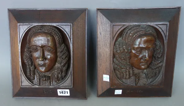 A pair of relief carved oak plaques, late 19th century, depicting 'Bach' and Handel', titled to the wide border, indistinctly stamped to the rear and