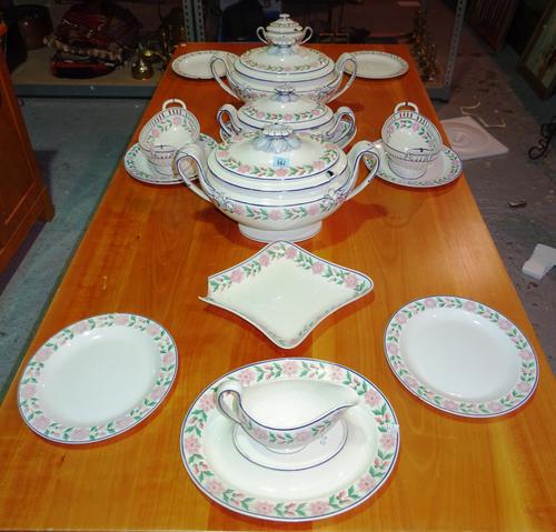 Wedgwood cream ware part dinner service, decorated with blue bands and pink flowers, (a.f)  H2