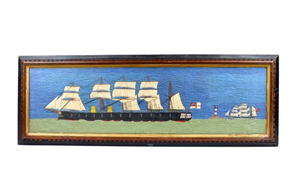 A woolwork ship picture, early 20th century, polychrome colours, depicting two fully rigged war ships around a lighthouse, framed and glazed, 114cm x