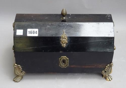 A 19th century gilt metal mounted coromandel dome top casket, on paw feet, 29cm wide x 21cm high x 18cm deep.