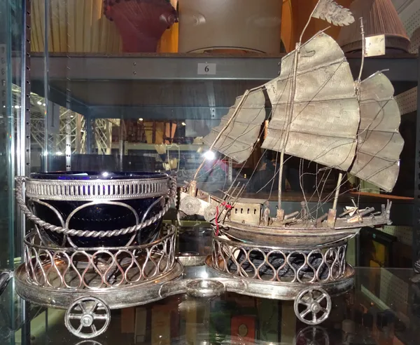 Collectables, comprising; a white metal model of a Chinese junk, plated twin bottle cart coaster, pierced plated bowl with blue liner, (3).  CAB