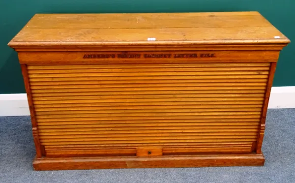 'Amberg's Patent Cabinet Letter File', a mid-20th century oak tambour fronted filing cabinet, with twelve drawers on plinth base, 115cm wide x 66m hig