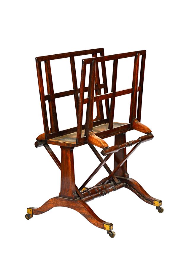 After a design by Holland & Son; a Victorian rosewood folio stand with adjustable lattice frame, on trestle end standards and four downswept supports,