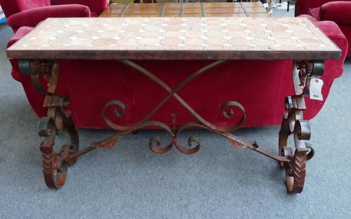 A 20th century console table, the mosaic rectangular top on a scrolling wrought iron base united by stretcher, 145cm wide x 52cm deep x 89cm high.