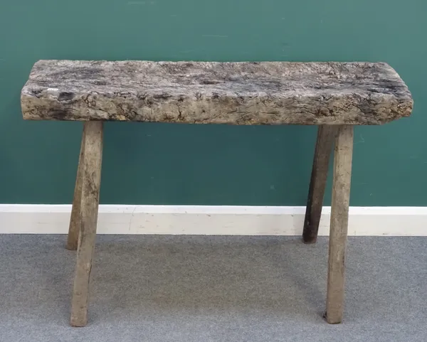 A rustic slaughter table, the rectangular top (probably elm) on four staked supports, 129cm wide x 86cm high x 50cm deep.
