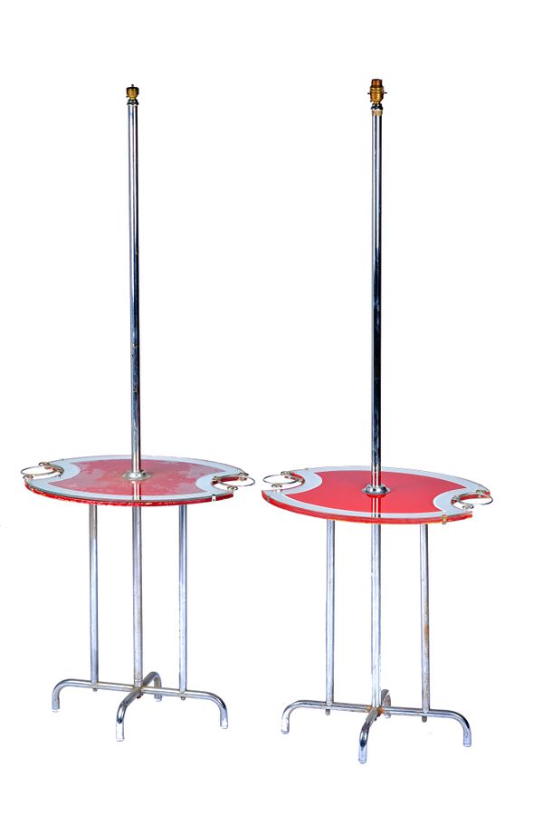 A pair of 20th century chrome standard lamps, each with oval coloured glass platform, with integral glass/ashtray holder, on four downswept supports,