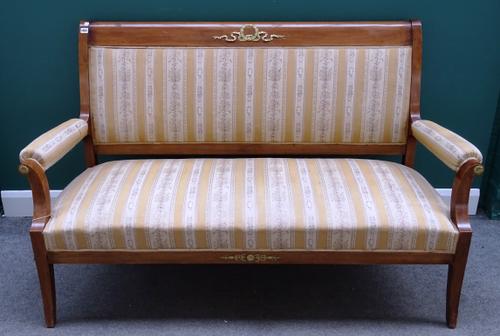 An Empire style gilt metal mounted mahogany salon suite, to comprise; a sofa (166cm wide x 103cm high), a pair of open armchairs (68cm wide x 98cm hig