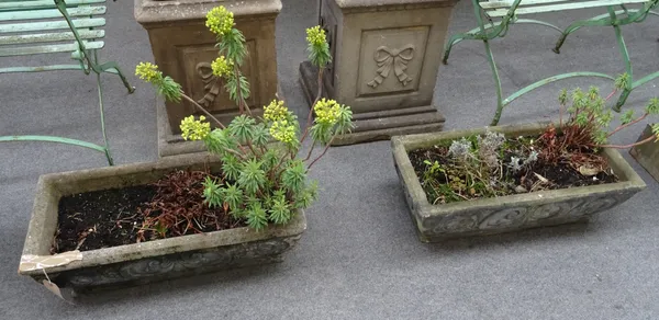 A set of four reconstituted stone rectangular planters, with scroll work bodies, each 73cm wide x 24cm high x 34cm deep, (4).