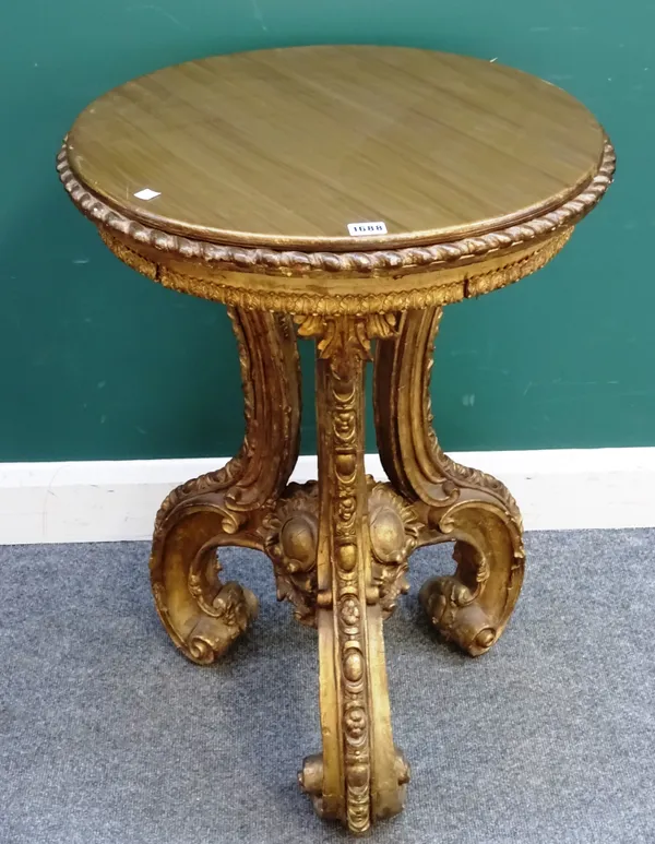 A 19th century gilt occasional table, the circular top on three scroll supports, 59cm wide x 81cm high.
