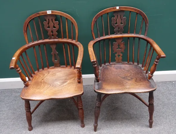 A near pair of George III yew and elm low back Windsor chairs, on turned supports, united by crinoline stretcher, each approximately 50cm wide x 87cm