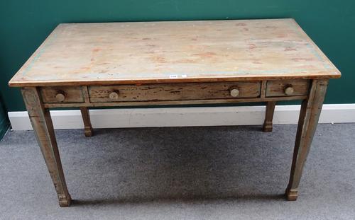An early 20th century painted pine kitchen table, with one true and two dummy frieze drawers, on tapering square supports, 76cm wide x 137cm deep x 75