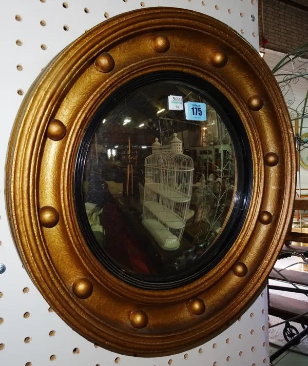 A 20th century gilt convex circular wall mirror, 40cm wide.  D5