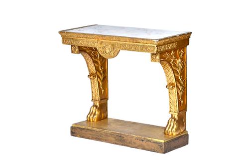 A 19th century console table, the rectangular marble inset top over a floral chased gilt base, with lion paw supports united by platform undertier, 95