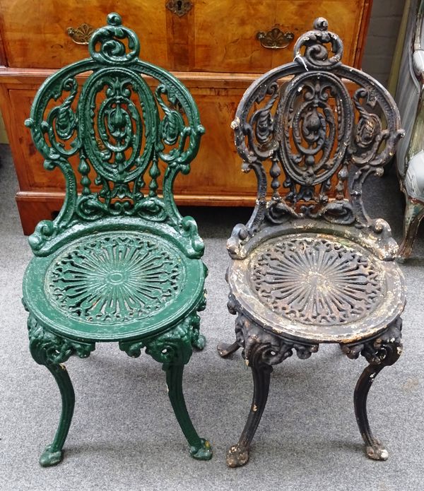 A set of five late Victorian cast iron garden chairs, with pierced circular seats, on scroll supports, 40cm wide x 89cm high, (5).