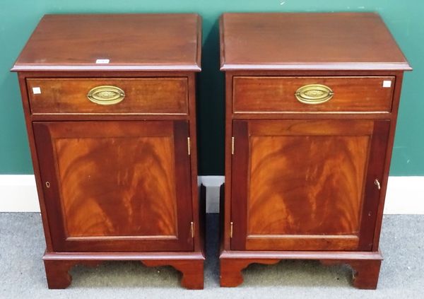 A pair of George III style mahogany bedside tables, each with single frieze drawer, over panelled cupboard, on bracket feet, 49cm wide x 75cm high x 4