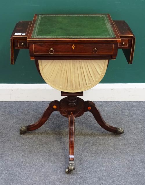 A Regency rosewood drop flap work/writing table, with angle adjustment top and pull out wool box, on four downswept supports, 61cm across, 89cm across
