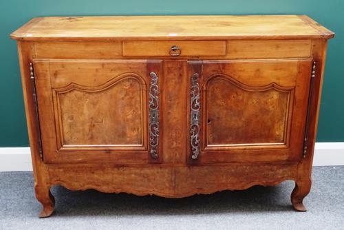A late 18th century/early 19th century French figured walnut and fruitwood buffet, with single drawer over cupboards, on painted square cabriole suppo