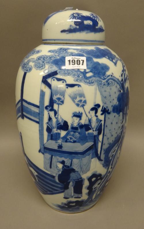 A tall Chinese blue and white vase and a cover, late 19th century, of slender ovoid form, painted with an official seated with attendants, 41cm. high