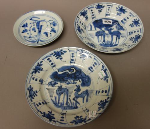 Four Chinese kraak porcelain blue and white plates, Wanli, each painted with two deer in a landscape beneath a panelled border enclosing fruit, 21.5cm