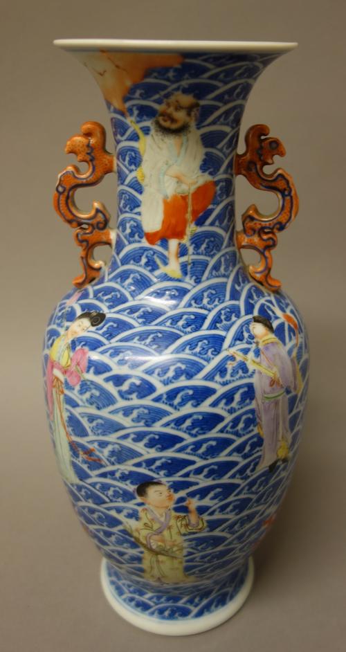 A Chinese famille-rose `Immortals' two-handled baluster vase, blue Qianlong seal mark but later, well painted with the eight Immortals standing amongs