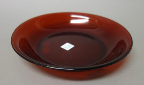 A Chinese ruby glass bowl, of shallow form with everted rim, 19cm. diameter. R & V. Tregaskis paper label to base.
