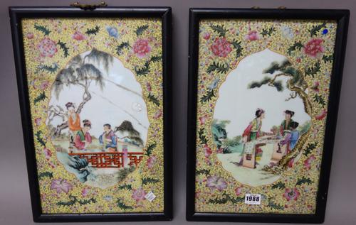 A pair of Chinese yellow-ground famille-rose rectangular plaques, 20th century, each painted with three young women at leisure in a landscape against