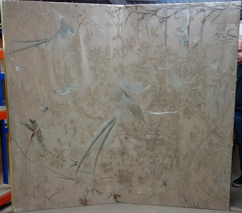 A large Chinese embroidered silk panel, early 20th century, depicting pheasants and other birds amongst flowering trees and shrubs, 219 cm. by 199cm.,