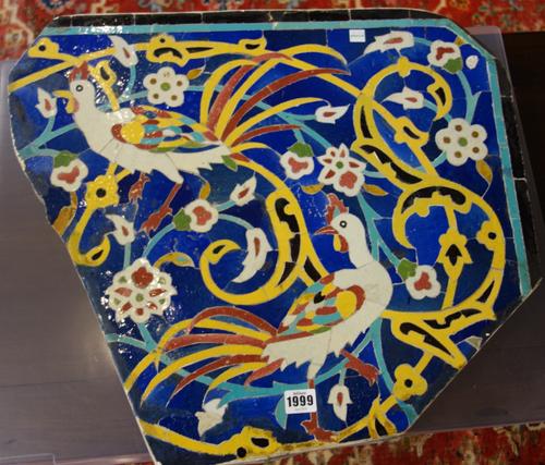 A Safavid style pottery panel, probably 19th century, inlaid and painted with long tailed birds amongst flowers against a cobalt blue ground, (a.f), 5